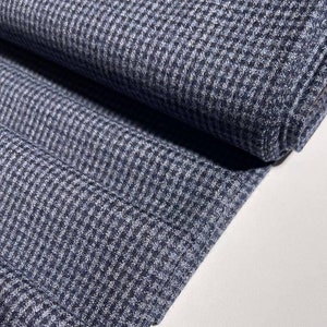 Woolen flannel in navy blue. Soft Italian fabric for blazers, trousers, skirts, dresses, and coats.