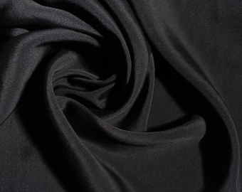 Silk CADY in a deep black color. Soft natural silk with a subtle sheen, perfect for evening gowns, blouses, and trousers.