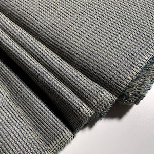 Italian wool fabric with a touch of silk. Soft material for suits, jackets, trousers, skirts, and dresses.