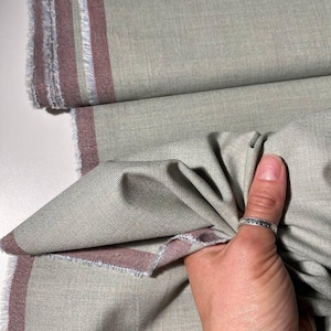 Italian wool fabric with a blend of linen and silk. Crease-resistant material. Perfect for suits, jackets, dresses, and scarves.