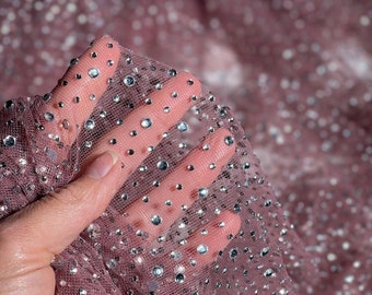 Elastic mesh with sparkling crystals. Striking fabric for evening gowns, ball dresses, blouses, and shiny accessories.