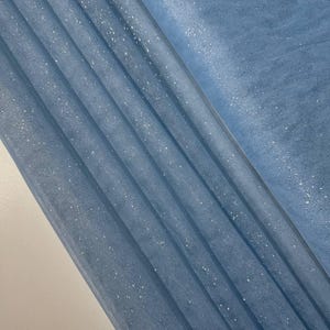 Spectacular, shiny fabric for sewing. Soft fabric with glitter. Lightweight glitter fabric, suitable for evening and ball gowns.