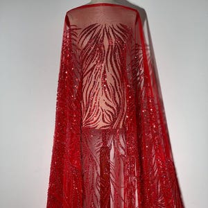 Encaje rojo de noche con bordado denso y lentejuelas. Tejido brillante para vestidos de noche. 1 unidad = 0,1 metro lineal (10 cm)