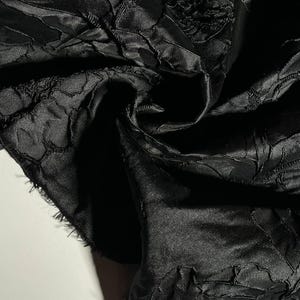 Soft jacquard fabric. Elegant floral jacquard. Rich fabric with an elegant floral motif for evening gowns and ball dresses.