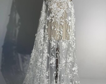 Matte wedding lace with dense floral embroidery. Embellished with sequins and beads. Perfect for wedding dresses and veils.