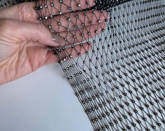 Mesh adorned with glass crystals. Stretch luxurious lace for blouses, dresses, tops, skirts, elegant accessories.
