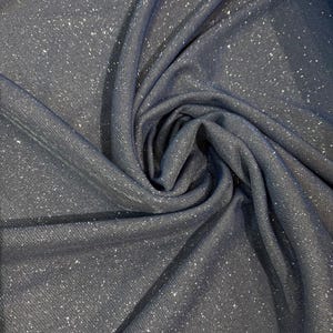 Tessuto elastico e opaco con glitter. Tessuto morbido e di alta qualità per abiti lucenti e accessori appariscenti.