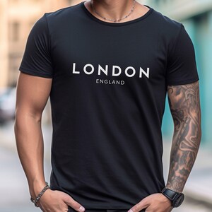 May include: Black t-shirt with white text that reads "LONDON ENGLAND"