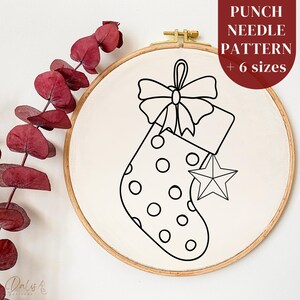 May include: A black and white line drawing of a Christmas stocking with a bow on top and a star hanging from the toe. The stocking is decorated with polka dots. The image is on a white background.
