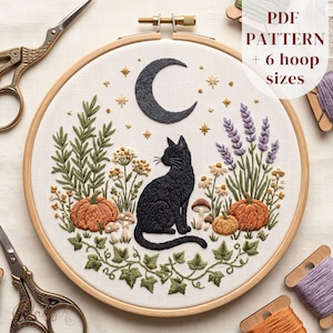 May include: An embroidery hoop containing a fabric panel with a stitched design of a black cat sitting among pumpkins, lavender, mushrooms, and ivy. Above the cat is a crescent moon and stars. Text on the image reads: PDF PATTERN + 6 hoop sizes.