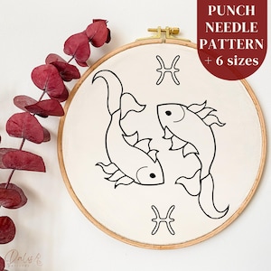 May include: A punch needle pattern featuring a black and white illustration of two fish and the Pisces symbol. The design is set within a wooden embroidery hoop. The text "PUNCH NEEDLE PATTERN + 6 sizes" is displayed in a maroon rectangle.