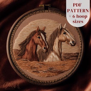May include: An embroidered artwork featuring two horses in shades of brown and tan, set within a wooden hoop. The horses are depicted with detailed stitching, and the background has a gradient effect. Text on the upper right reads "PDF PATTERN + 6 hoop sizes."