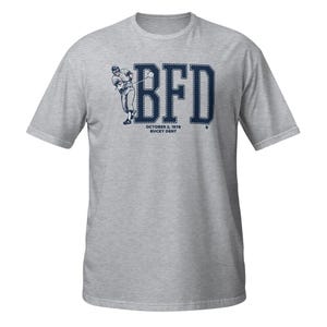May include: Gray t-shirt with a blue graphic of a baseball player hitting a ball with the text "BFD" above the player and "OCTOBER 2, 1978 BUCKY DENT" below the player.
