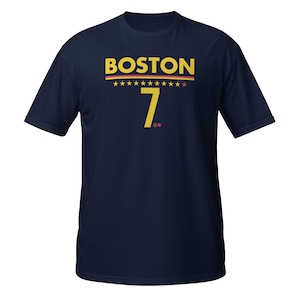 May include: A navy blue t-shirt with the text "BOSTON" in yellow letters and a yellow number "7" below it. There are 10 yellow stars above the text.