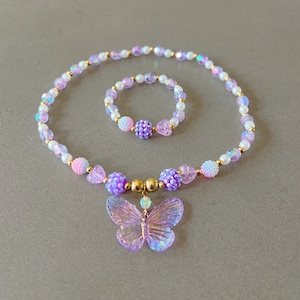 Kids necklace and bracelet set with purple butterfly charm.