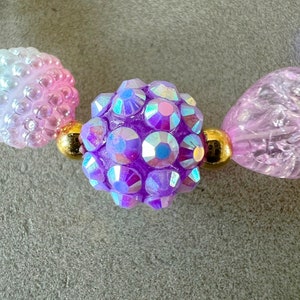 Kids necklace and bracelet set with purple butterfly charm.