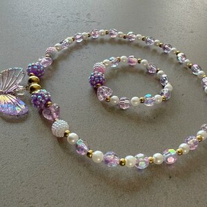 Kids necklace and bracelet set with purple butterfly charm.