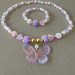 Kids necklace and bracelet set with purple butterfly charm.