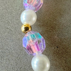 Kids necklace and bracelet set with purple butterfly charm.