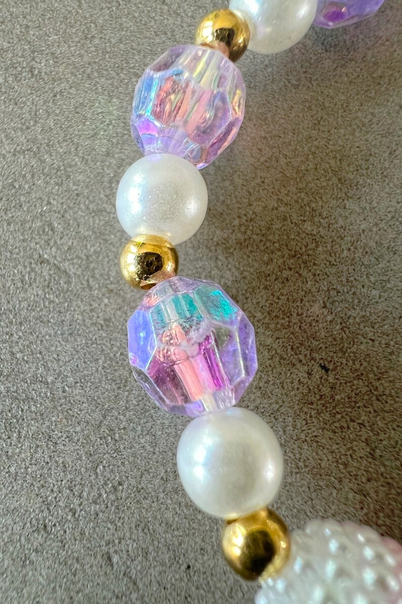 Kids necklace and bracelet set with purple butterfly charm.
