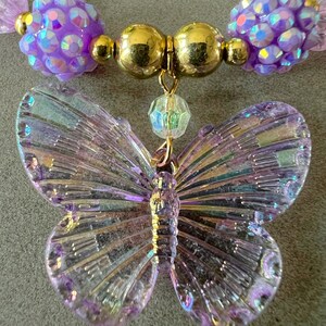 Kids necklace and bracelet set with purple butterfly charm.