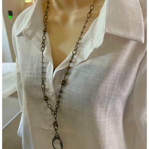 Layered necklace with clear glass crystal pendants.Layered necklace with clear glass crystal pendants.