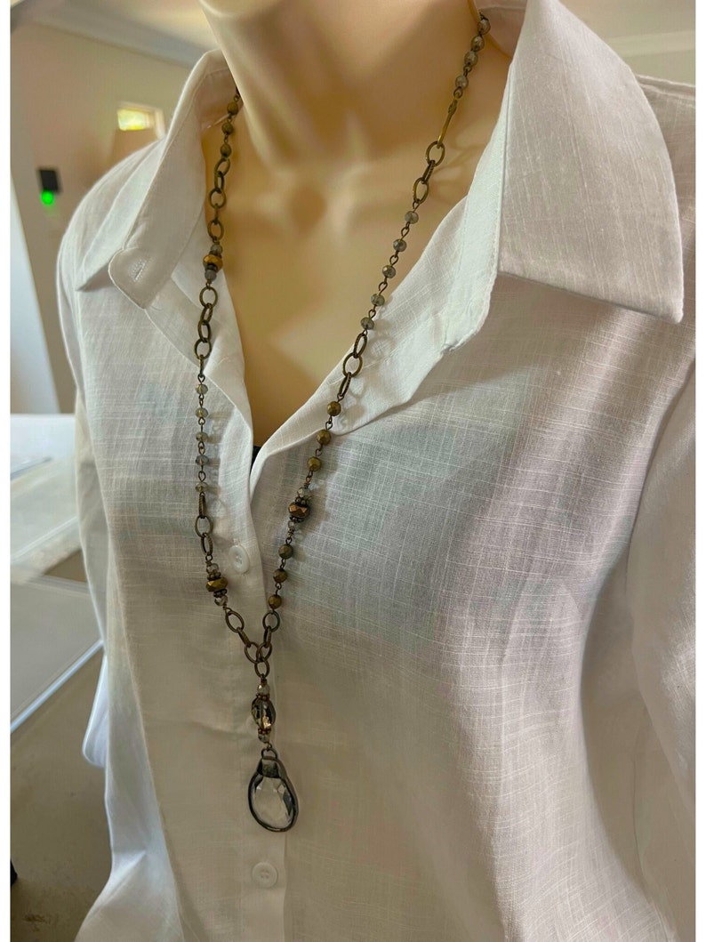 Layered necklace with clear glass crystal pendants.Layered necklace with clear glass crystal pendants.