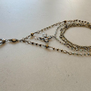 Layered necklace with clear glass crystal pendants.
