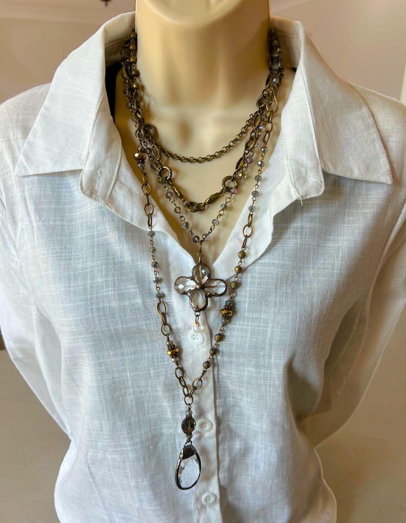Layered necklace with clear glass crystal pendants.