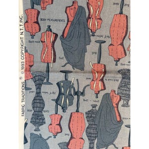May include: Fabric with a repeating pattern of dress forms in coral and gray. The dress forms are of various styles, some with measuring tapes. Text includes "BODY MEASUREMENTS" and "FABRIC TRADITIONS © 1993 COPYRIGHT N.T.T.INC."