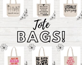 May include: Six different tote bags with various designs and text. The bags are all beige with black text and designs. The text on the bags includes: "helping little minds grow", "influencer, motivator, believer, encourager, educator", "literally freezing", "text me when you get home", "be kind to your mind", and "do what makes you happy".