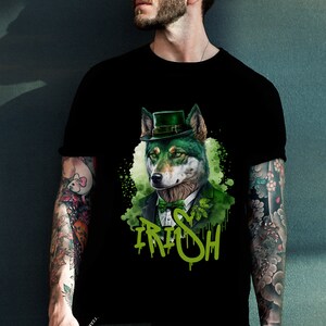 May include: Black t-shirt with a green wolf wearing a green hat and a bow tie. The wolf has green eyes and a white nose. The text "IRISH" is written in green below the wolf.
