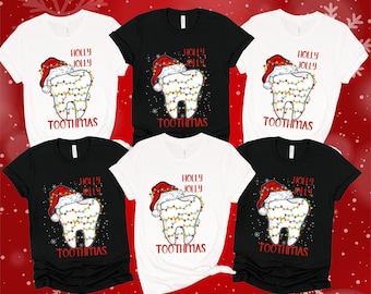 May include: Six t-shirts with a Christmas-themed design featuring a tooth wearing a Santa hat and Christmas lights. The text on the shirts reads "Holly Jolly Toothmas".