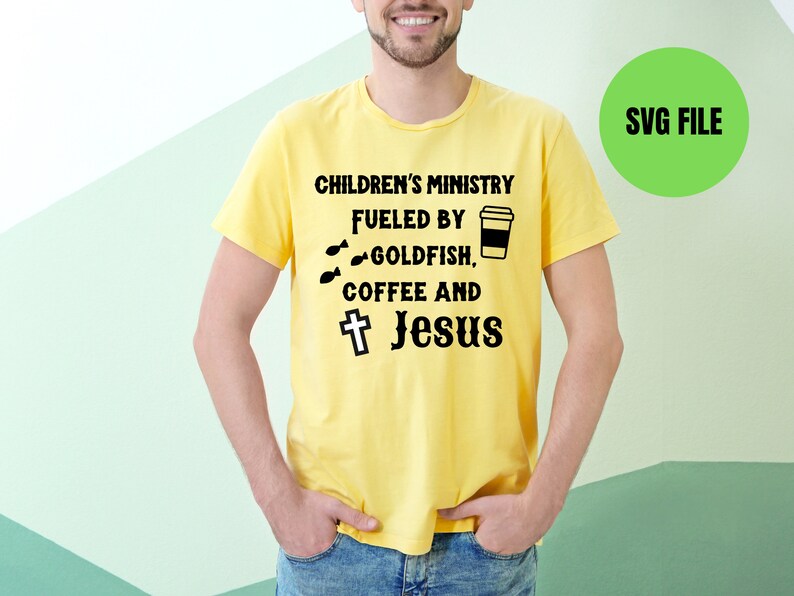 May include: A yellow t-shirt with the text "Children's Ministry Fueled by Goldfish, Coffee and Jesus" with a cross and a coffee cup graphic.