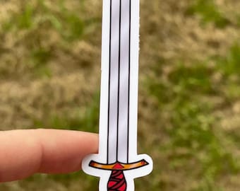 May include: A white sticker of a silver sword with a red and gold handle.