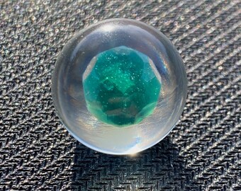 Emerald in epoxy sphere, green LED