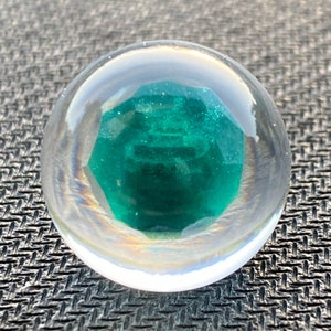 Emerald in epoxy sphere, green LED