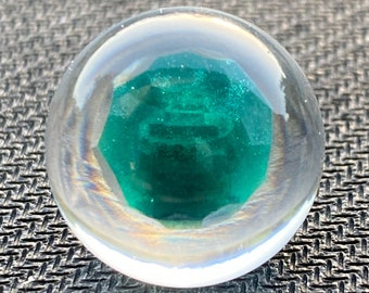 Emerald in epoxy sphere, green LED