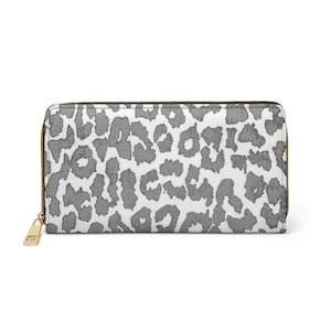 Cartera con cremallera y diseño descolorido en blanco y negro con estampado de leopardo