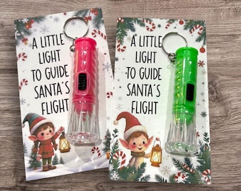 Mini linternas navideñas como obsequio para fiestas, con tarjetas personalizables: "Una lucecita para guiar el vuelo de Papá Noel".