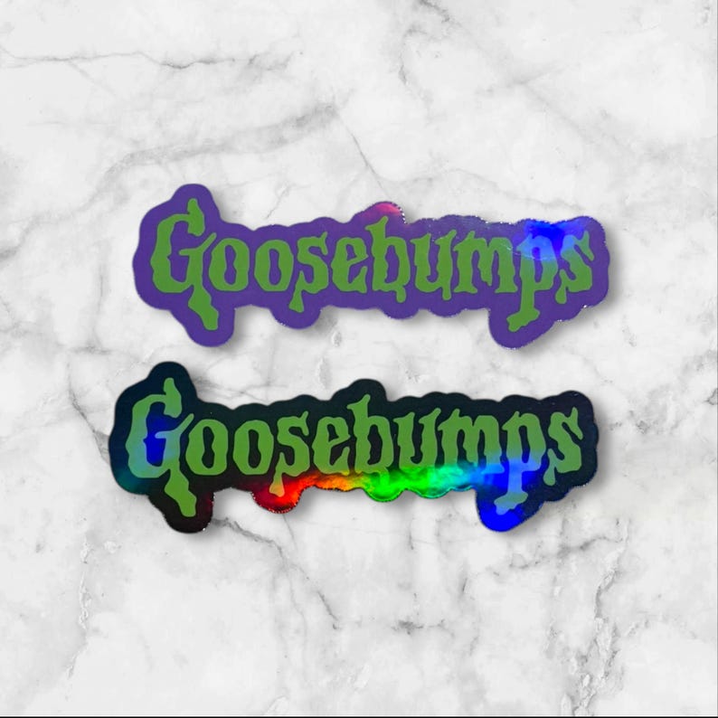 May include: Two die-cut stickers featuring the word Goosebumps in a stylized, jagged green font. The top sticker has a purple outline, while the bottom sticker features a multi-colored holographic effect that shifts between blue, green, and red tones.