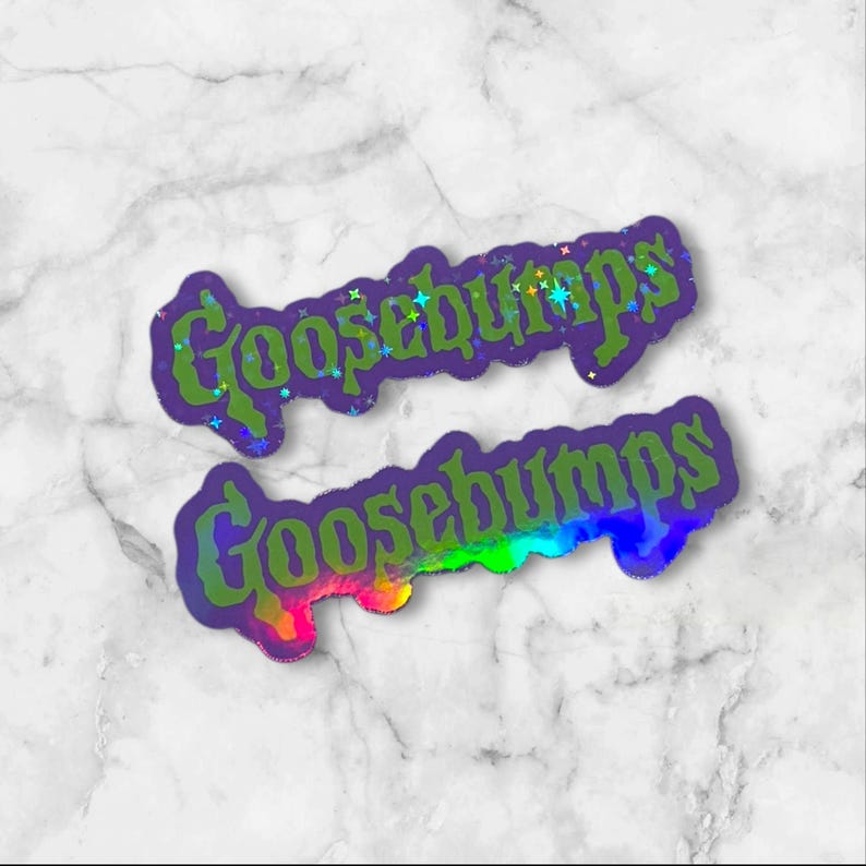 May include: Two die-cut stickers featuring the word Goosebumps in a stylized, jagged green font. The top sticker has a holographic finish with small star accents, while the bottom sticker displays a vibrant rainbow gradient effect.