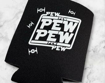 May include: Black neoprene can cooler with white text that reads "PEW PEW PEW" in a retro video game style font.