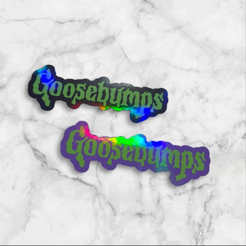 May include: Two die-cut stickers featuring the word Goosebumps in a stylized, dripping green font. The stickers have a holographic finish that reflects various colors, including blue, yellow, and purple, against a white marble background.