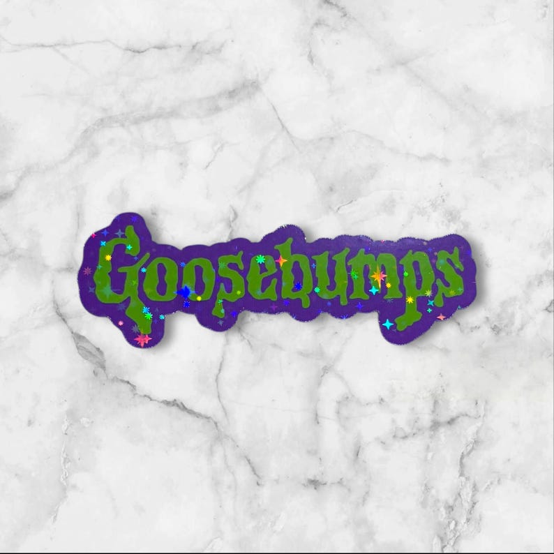 May include: A die-cut sticker featuring the word Goosebumps in a stylized, jagged green font with a dark purple outline. The lettering is decorated with small, colorful, multi-pointed star shapes in shades of blue, pink, yellow, and orange.