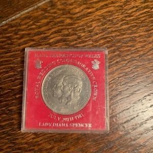 1981 Crown coin, The Royal Wedding of Lady Diana Spencer and Prince Charles, in excellent uncirculated condition, housed in a plastic case.