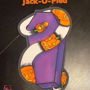 May include: A sticker featuring a snake design with orange jack-o'-lanterns and a purple background. The text "Jack-O-Pied" is at the top, with "Thorn The Robot" and "Necro Morphix" written on the sticker.