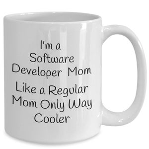 May include: White ceramic mug with a curved handle. The mug features black text that reads: "I'm a Software Developer Mom Like a Regular Mom Only Way Cooler."