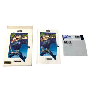 May include: A Castle Wolfenstein video game set by Muse Software, including a white cardboard box, a manual, and a black floppy disk. The cover art features a soldier in a helmet running with a rifle against a blue and green background.