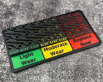 Tabela de espessura do guia de desgaste da banda de rodagem do pneu para exibição em mesa